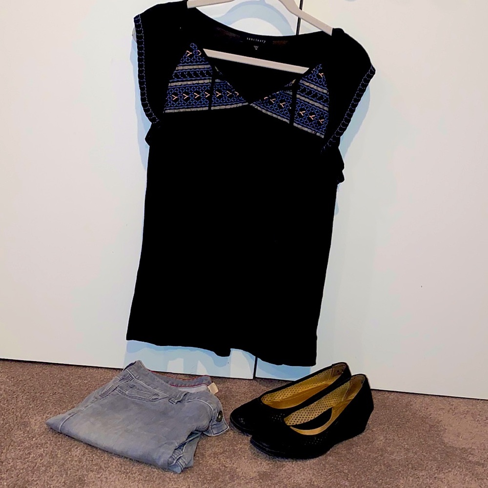 Size medium black sanctuary top with ruffle sleeve, tie front and embroidery